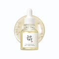 Skincare serum bottle with dropper on a white background