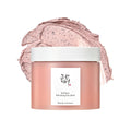 Pink facial mask jar with a white lid on a white background